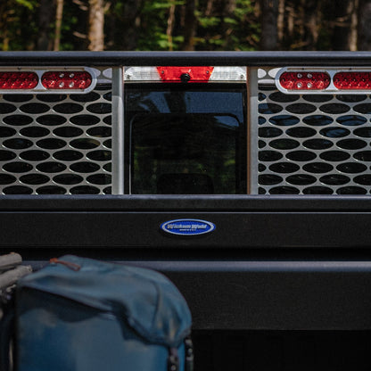 Truckbed with a black crossbox and Wickum rack