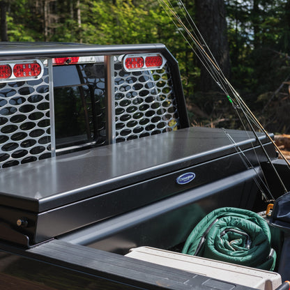 Black crossbox with fishing gear in the truck bed